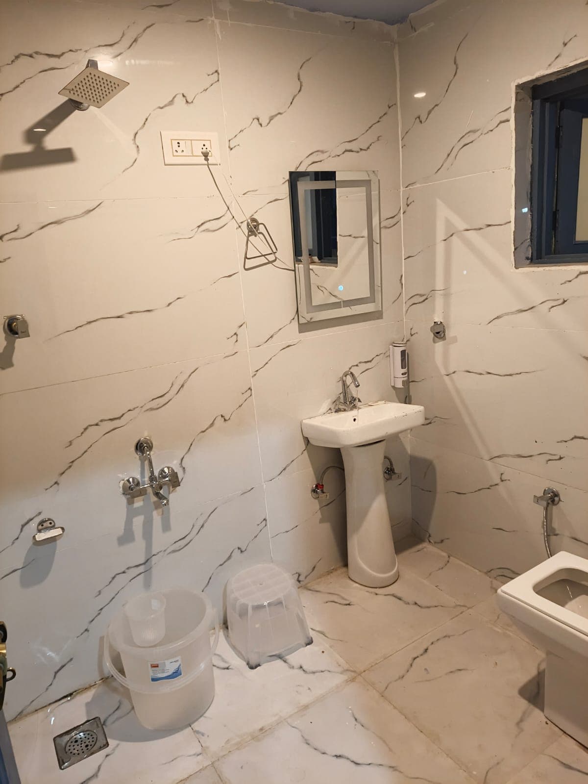 Clean attached bathroom in a hotel room arranged for our pilgrims